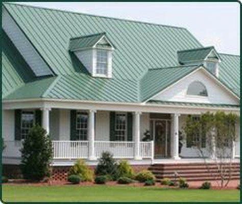 green brick house with white metal roof|light green metal roofing.